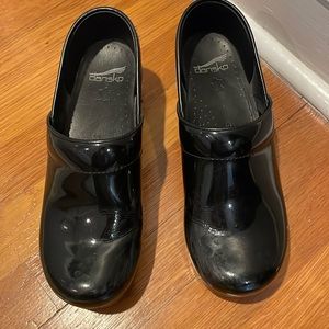 Dansko patent leather clogs